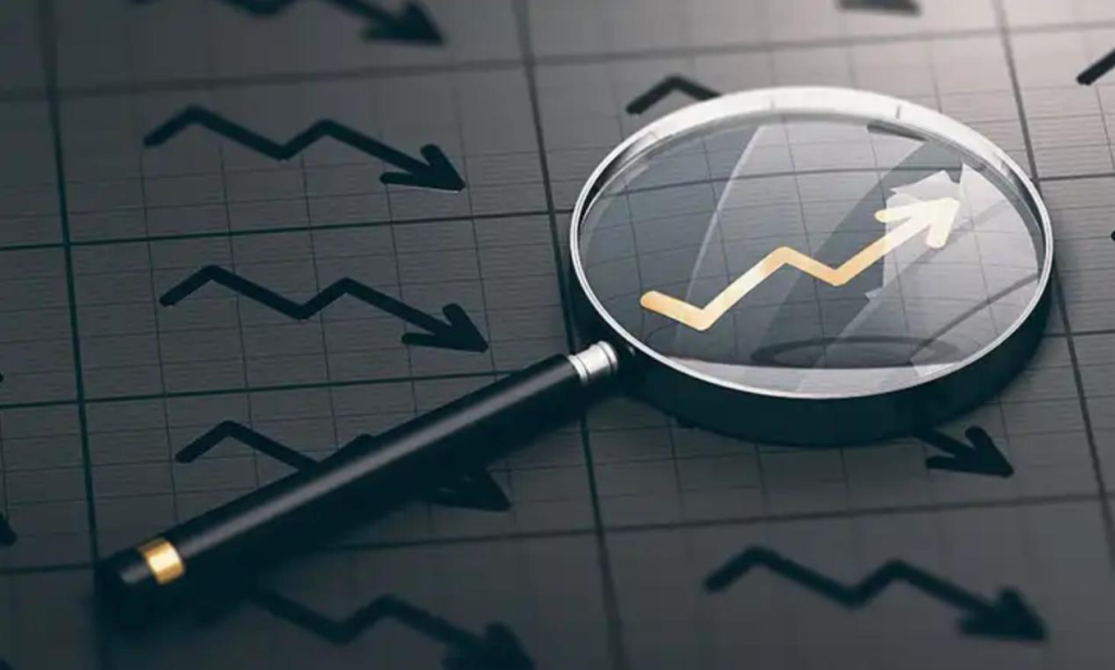  Magnifying glass highlighting upward trend on a financial chart